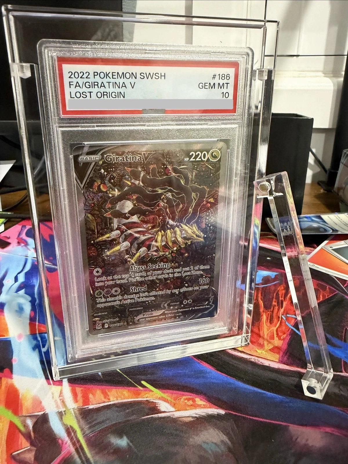 UV-shield acrylic protector displaying a PSA graded Pokémon card